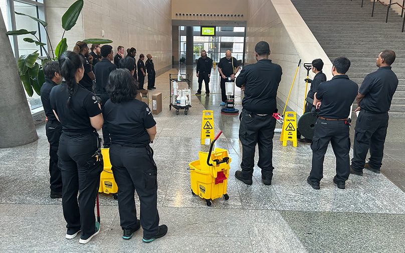Facilities and housekeeping staff gathered in the main lobby. 
