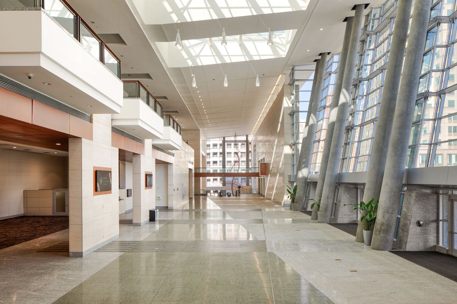 A full view of the empty main lobby of the Atlantic Union Bank Convention Center facing north in the daytime.