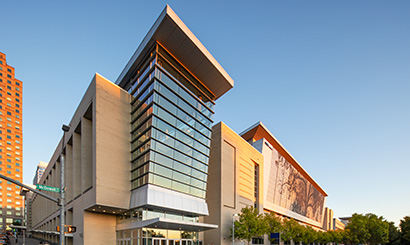 Exterior of the Atlantic Union Bank Convention Center showing large windows and shimmer wall in daytime.